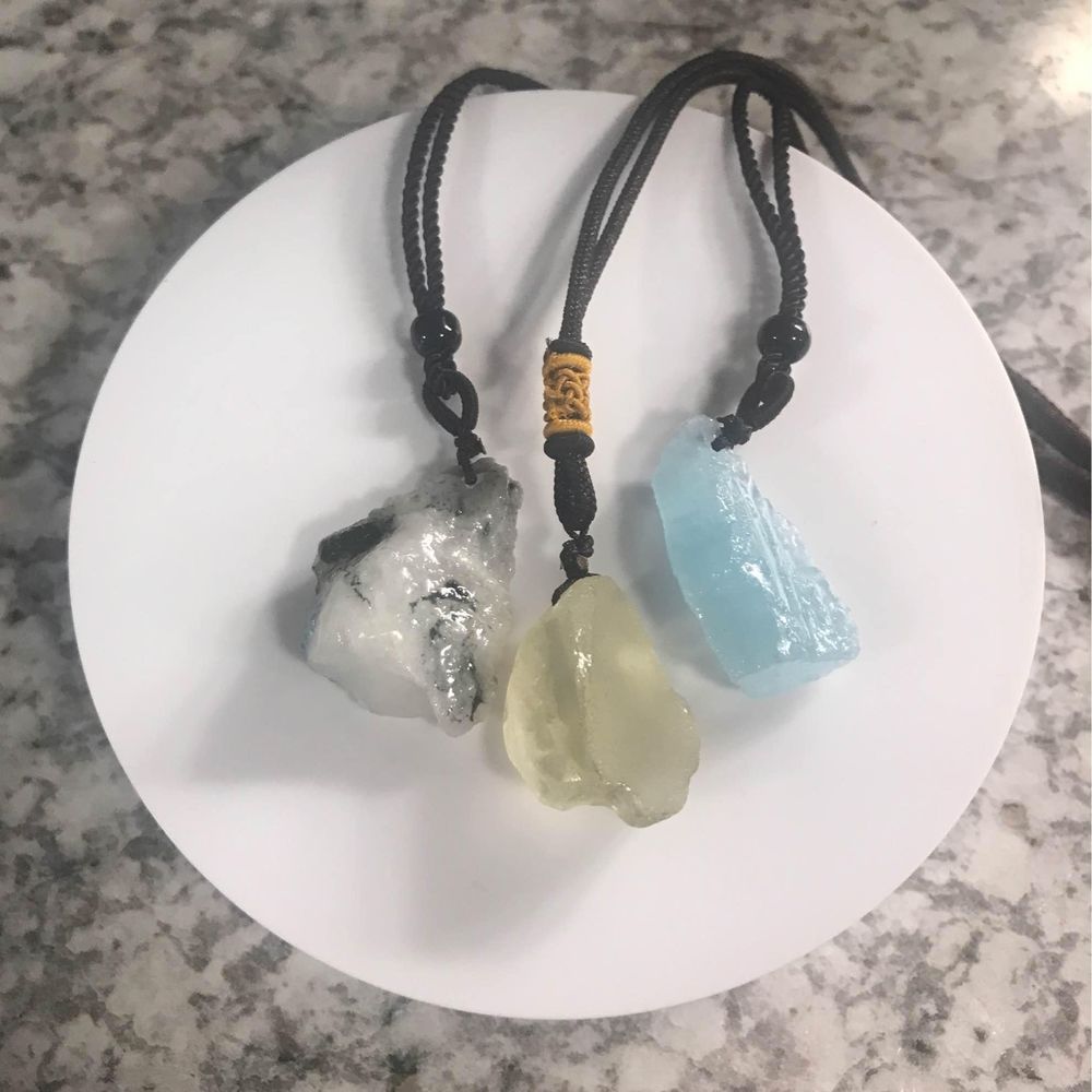 Lot of 3 crystal stones on brown cord necklaces